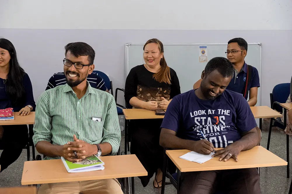 Theological students listening to a class in South Asia