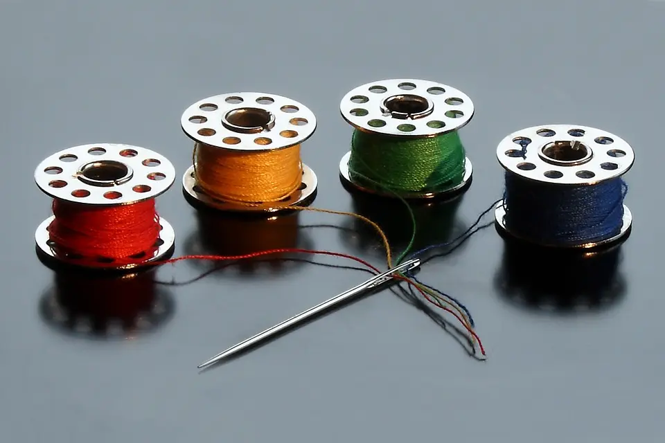 four spools of sewing thread