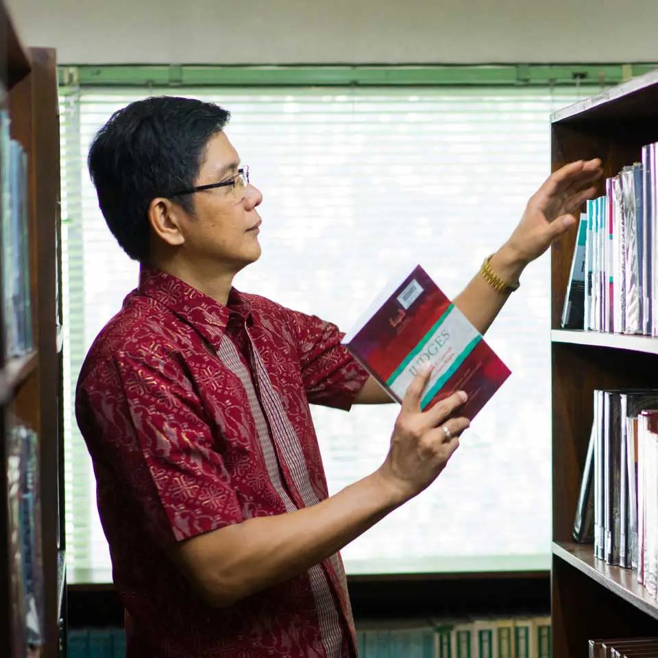 Ricco in a theological library in Philippines